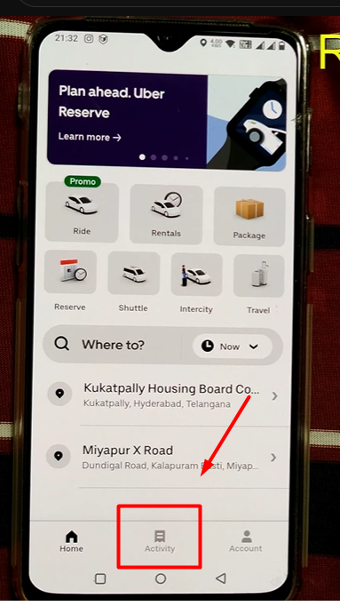 pointing towards Activity button in the uber app