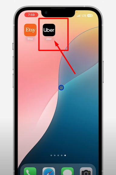 Screenshot of mobile screen pointing towards uber app icon